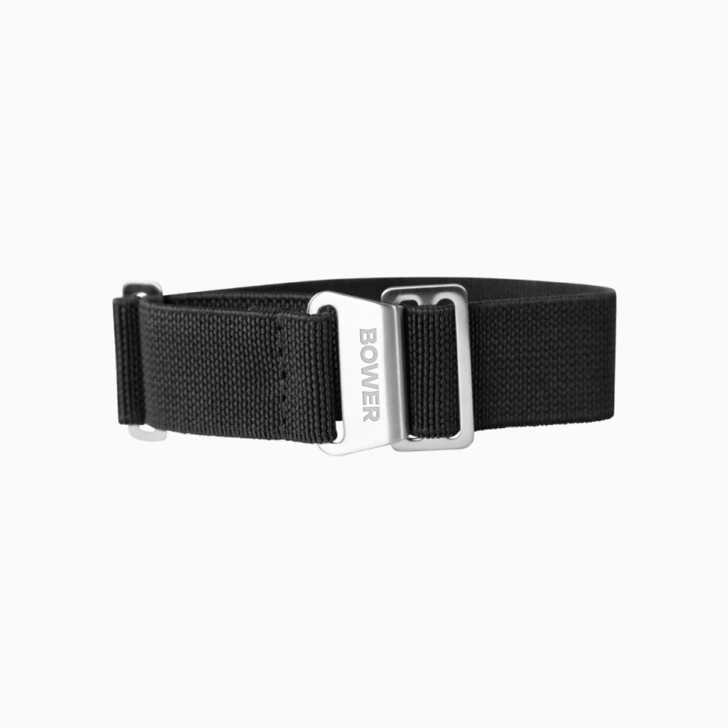 Black nylon watch strap by Bower featuring a brushed stainless steel hook clasp engraved with the BOWER logo. Durable and adjustable, designed for comfort and outdoor performance.