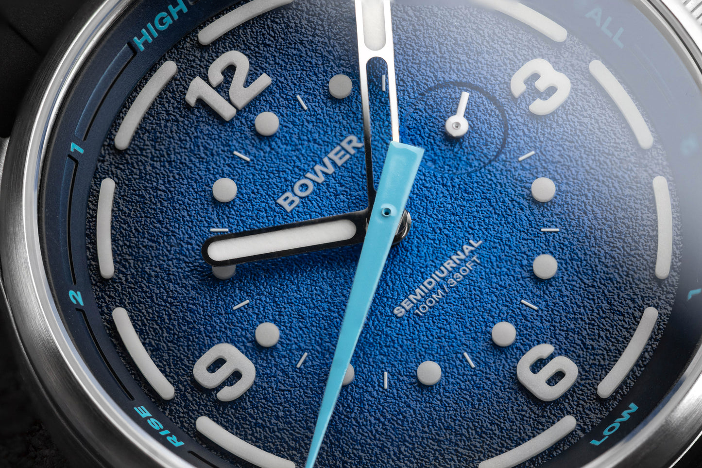 Close-up of Deep Blue Tide Seeker watch face by Bower, showing textured dial, tide indicator hand, and semidiurnal tide markings. Australian-designed ocean tool watch.